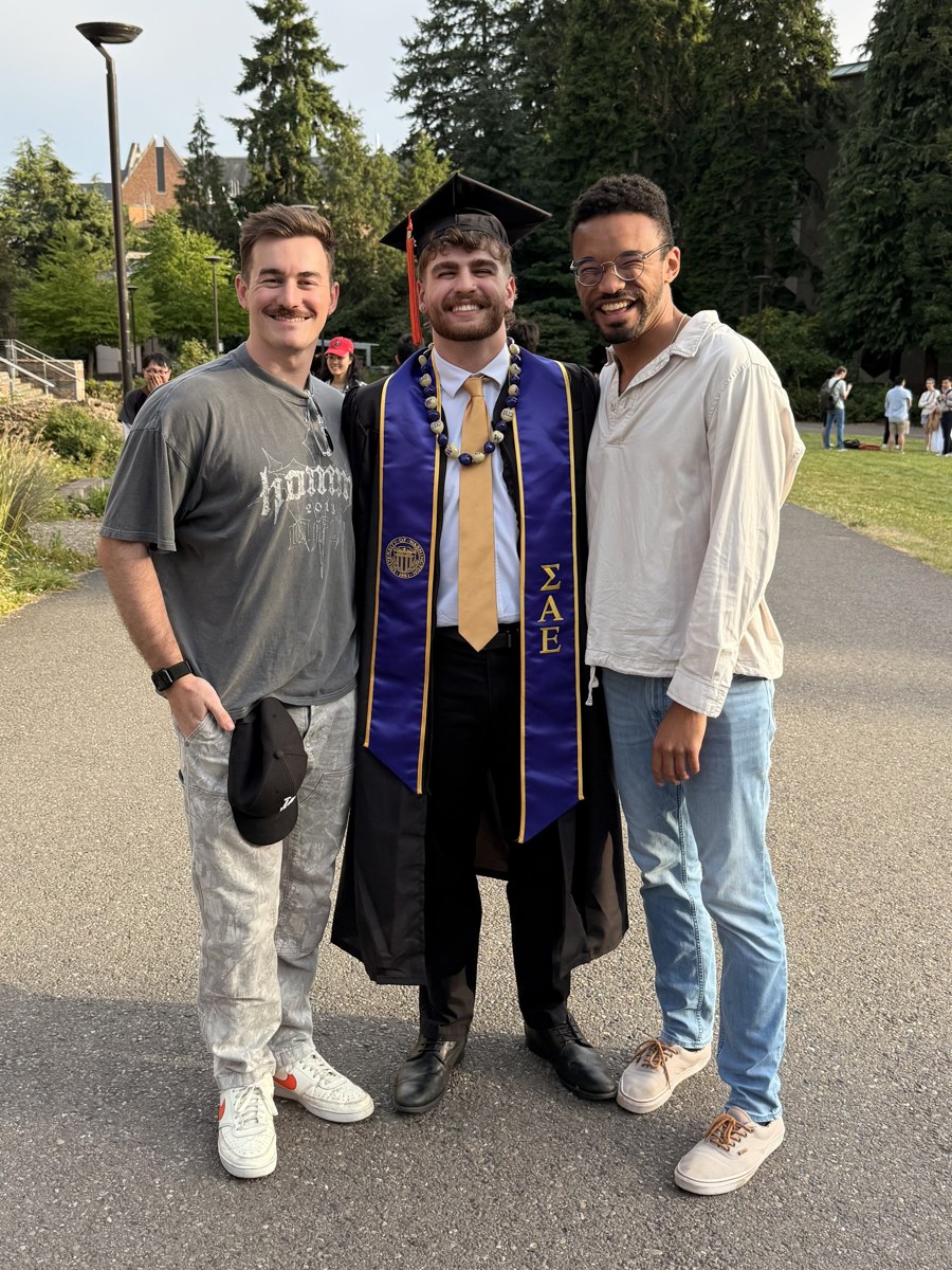 Gavin celebrating graduation with friends